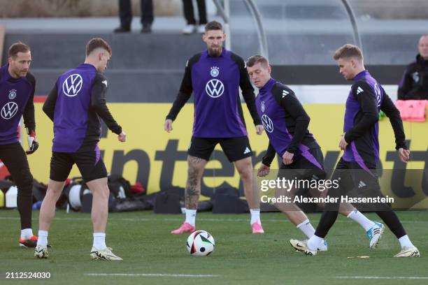Oliver Baumann, Joshua Kimmich, Robert Andrich, Toni Kroos and Maximilian Mittelstädt of Germany pla with the ball during a training session of Team...