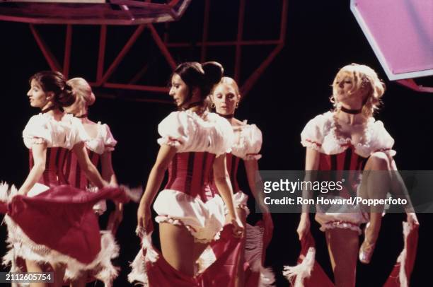 British dance troupe Pan's People perform together on the set of a pop music television show in London circa 1970. Members of this original line up...