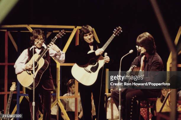 From left, guitarists Hank Marvin, Bruce Welch and John Farrar of English instrumental music group The Shadows perform as Marvin, Welch & Farrar on...