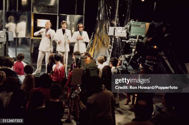 From left, John Gorman, Mike McGear and poet Roger McGough perform as The Scaffold in front of a studio audience on the set of a pop music television...