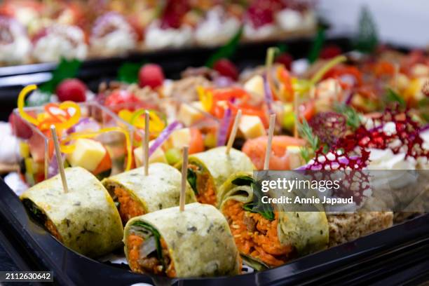 catering platters. lined with rows of canapes, savory mini food bites - prosciutto stock pictures, royalty-free photos & images