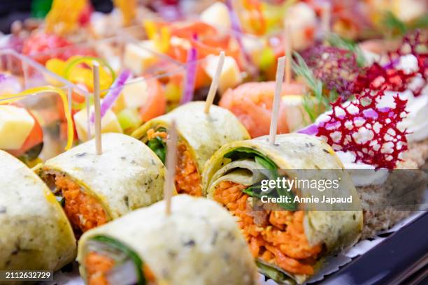 party food closeup, canapes on black serving trays - prosciutto stock pictures, royalty-free photos & images