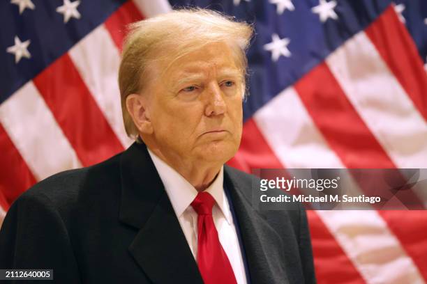 Former President Donald Trump listens as his attorney Todd Blanche speaks during a press conference at 40 Wall Street after a pre-trial hearing on...