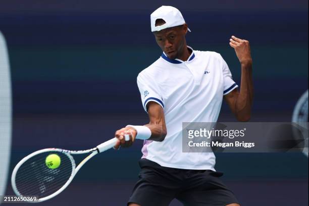 Chris Eubanks of the United States returns a shot to Alexander Zverev of Germany during his men's singles match during the Miami Open at Hard Rock...