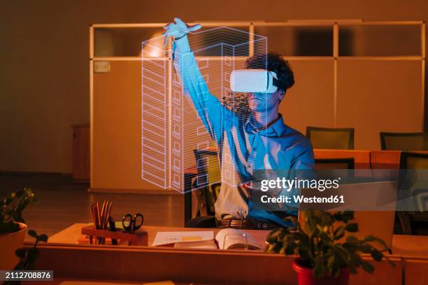 architect wearing virtual reality simulator and examining blueprint interface in office - lighting technique stock illustrations