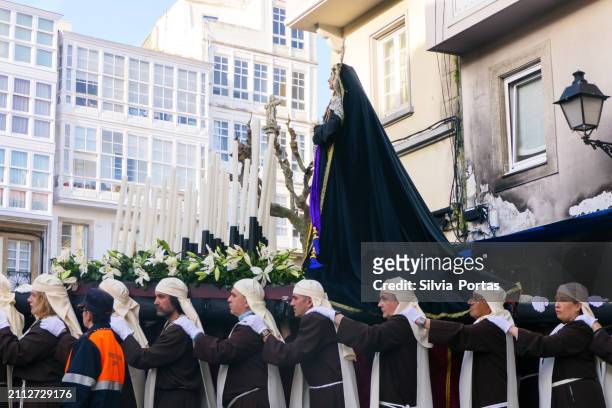 men of a religious confraternity carrying the virgin marching down the street during holy week in la coruña, galicia, spain - maundy thursday stock pictures, royalty-free photos & images