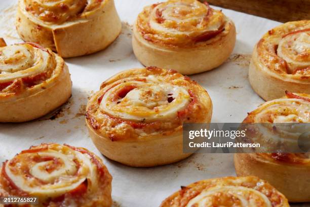 preparing baked pepperoni pizza rolls - savoury food stock pictures, royalty-free photos & images