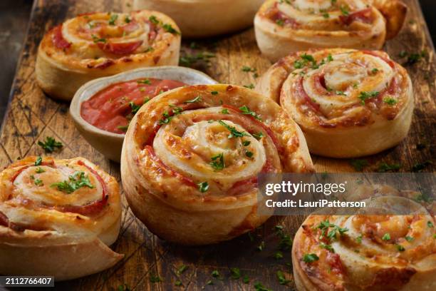 baked pepperoni pizza rolls - savoury food stock pictures, royalty-free photos & images