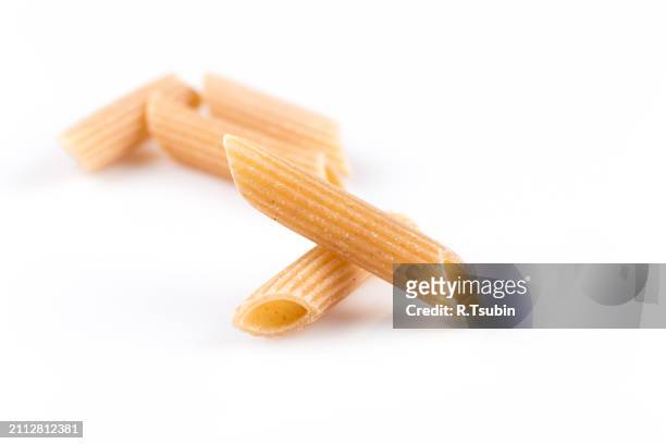 wholegrain penne pasta - vollkorn stock pictures, royalty-free photos & images