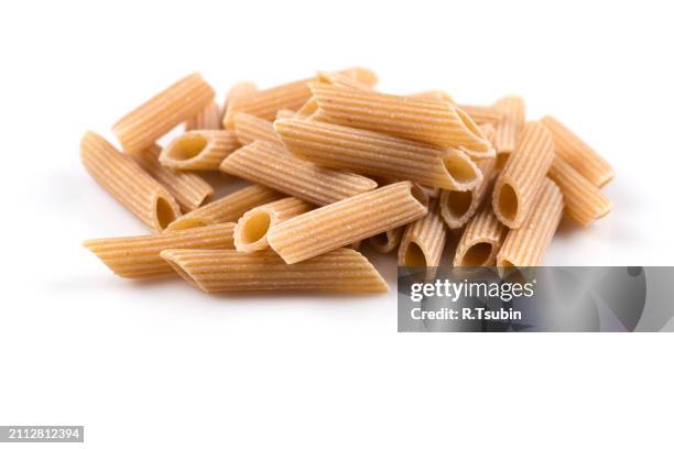 wholegrain penne pasta - vollkorn stock pictures, royalty-free photos & images