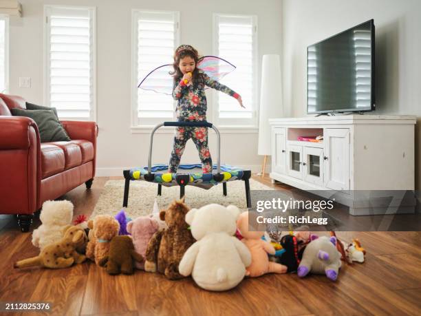 preschooler playing a make-believe concert - gig living room stock pictures, royalty-free photos & images