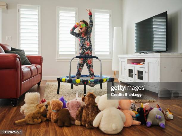 preschooler playing a make-believe concert - gig living room stock pictures, royalty-free photos & images