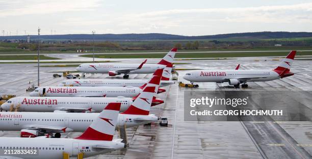 Airplanes operated by Austrian Airlines sit on the tarmac at the airport in Vienna, on March 28, 2024 due to a strike of the company's ground staff....