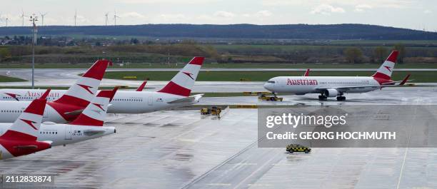 Airplanes operated by Austrian Airlines sit on the tarmac at the airport in Vienna, on March 28, 2024 due to a strike of the company's ground staff....