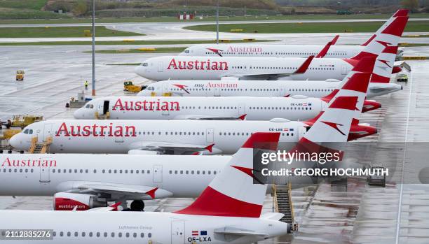 Airplanes operated by Austrian Airlines sit on the tarmac at the airport in Vienna, on March 28, 2024 due to a strike of the company's ground staff....