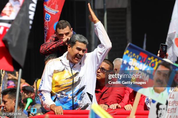 President of Venezuela Nicolás Maduro is surrounded by supporters on his arrival at the National Election Commission to formalize his candidacy to...