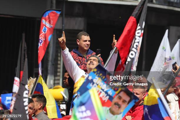President of Venezuela Nicolás Maduro is surrounded by supporters on his arrival at the National Election Commission to formalize his candidacy to...