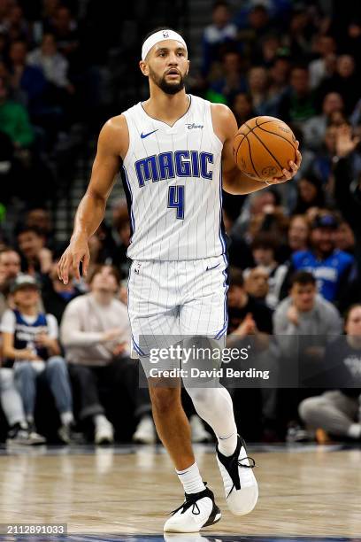 Jalen Suggs of the Orlando Magic dribbles the ball against the Minnesota Timberwolves in the fourth quarter at Target Center on February 02, 2024 in...