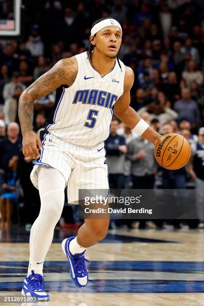 Paolo Banchero of the Orlando Magic dribbles the ball against the Minnesota Timberwolves in the fourth quarter at Target Center on February 02, 2024...