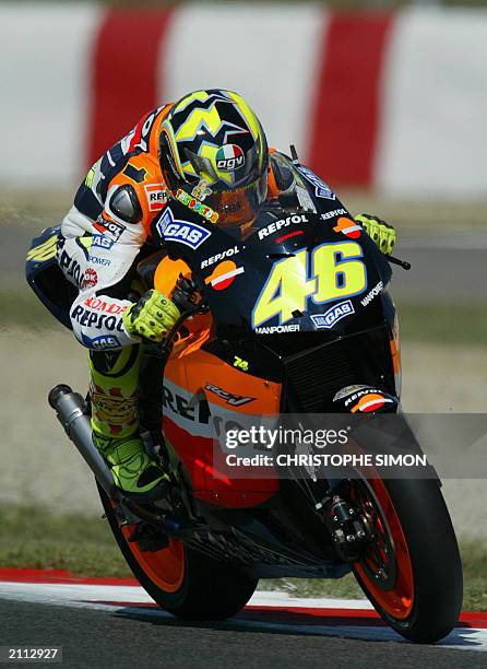 Italian driver Valentino Rossi with his honda takes a curve during the free practice of the Moto Grand Prix of Catalunya in Montmelo race track, 13...