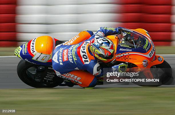 Spanish Fonsi Nieto takes a curve during the free practice of the Moto Grand Prix of Catalunya in Montmelo race track, 13 June 2003 . AFP Photo...