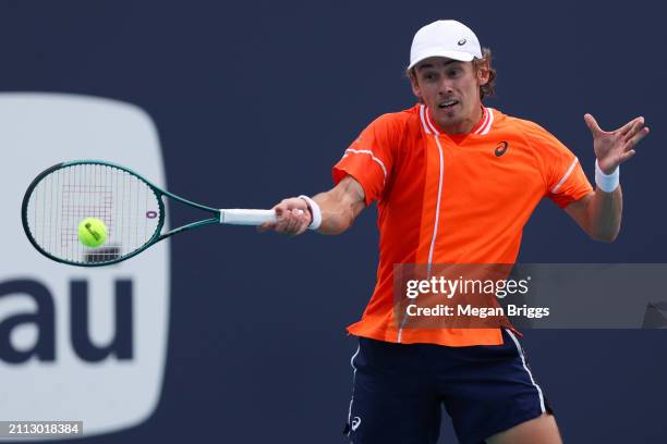 Alex De Minaur of Australia returns a shot to Jan-Lennard Struff of Germany during his men's singles match during the Miami Open at Hard Rock Stadium...