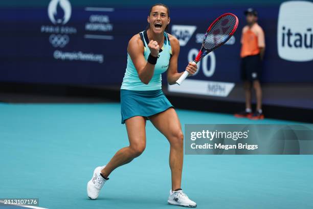 Caroline Garcia of France reacts after defeating Coco Gauff of the United States during their women's singles match during the Miami Open at Hard...