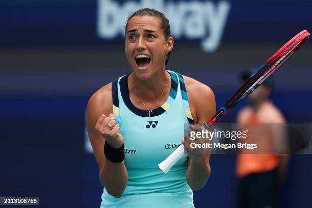 Caroline Garcia of France reacts after defeating Coco Gauff of the United States during their women's singles match during the Miami Open at Hard...