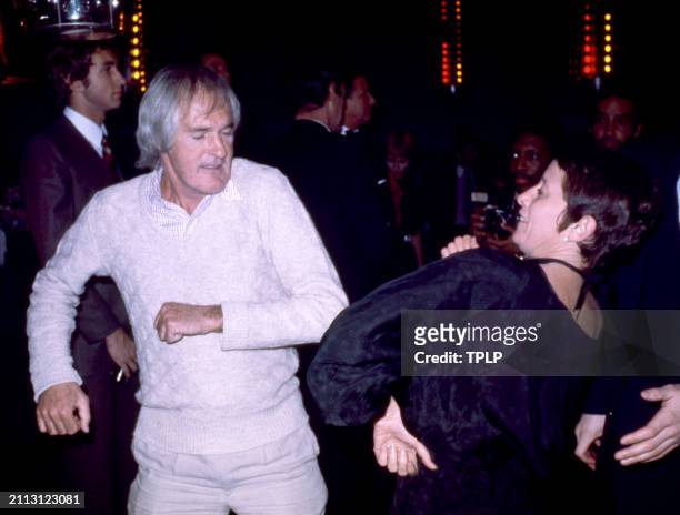 American psychologist Timothy Leary dances with an unidentified woman at the Manhattan nightclub and disco Studio 54 in New York, New York, March 6,...