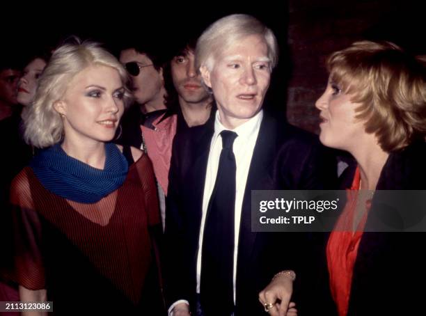 American musician Debbie Harry , of the American rock band Blondie, American visual artist Andy Warhol and American actress Lorna Luft attend a party...