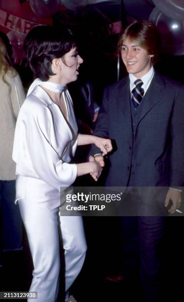 American actress Liza Minnelli talks to American actor James Spader at the Manhattan nightclub and disco Studio 54 in New York, New York, December...