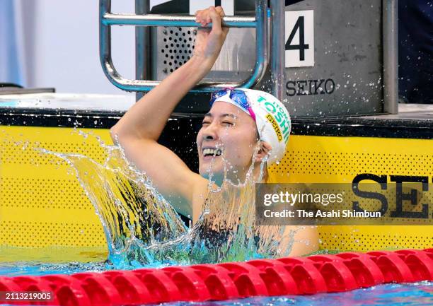Yui Ohashi celebrates winning and qualifying for the Paris Olympics after competing in the Women's 200m Individual Medley final during day eight of...