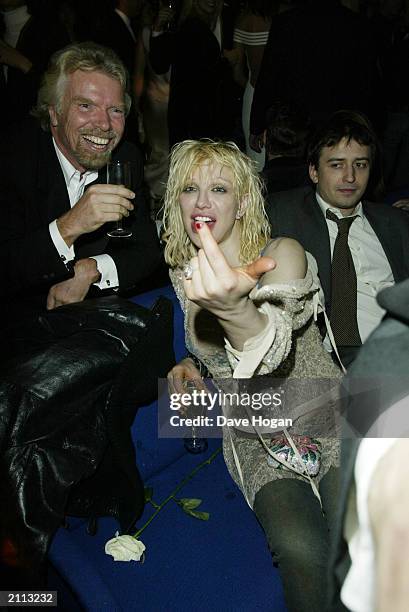 Founder and Chairman of the Virgin empire Sir Richard Branson and American rock star Courtney Love attend the star-studded Old Vic party held at Old...