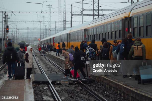 Passengers board the very first train that opened a direct link between Prague and Chop through Kosice , at Kosice railway station on Thursday, 28...