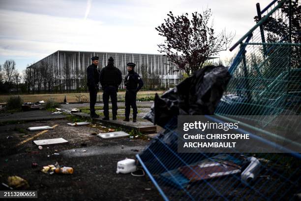 Gendarmes patrol a makeshift camp abandonned overnight by its occupants, mainly from the Roma community, ahead of a planned evacuation operation,...