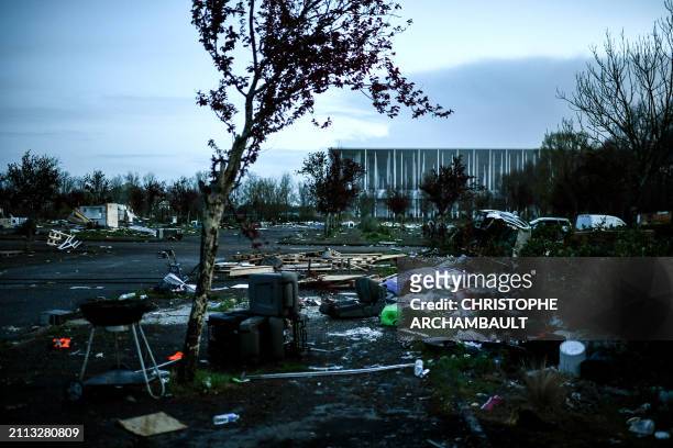 This photograph at dawn on March 28 shows debris and garbage at a makeshift camp abandonned overnight by its occupants, mainly from the Roma...