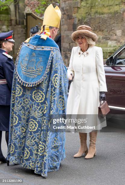 Queen Camilla is greeted by Bishop of Worcester Cathedral, The Right Reverend Dr John Inge as she arrives at The Royal Maundy Service at Worcester...