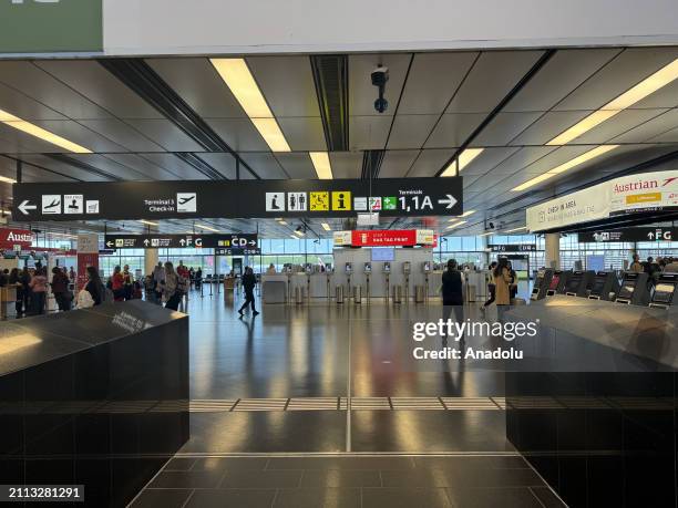 Passengers wait at the Schwechat International Airport as cabin crews working at Austrian Airlines go on strike after 17 salary negotiations between...