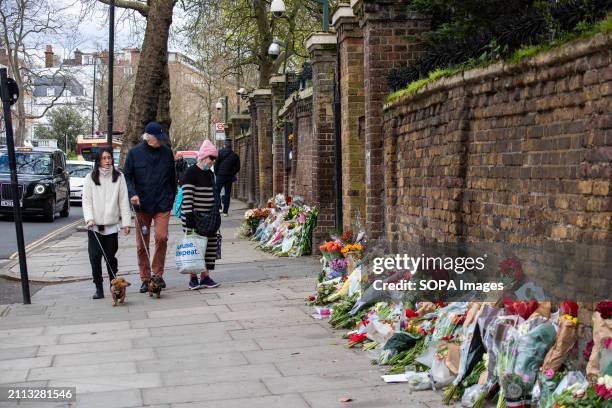 Passersby look at the flowers outside the Russian Embassy in London. Russian diasporas are mourning in London, UK because of the deadly terrorist...