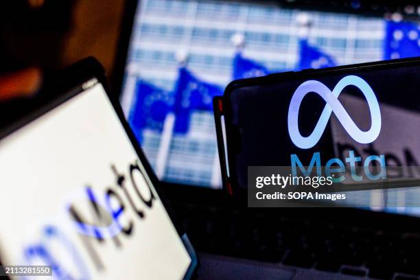 In this photo illustration, a Meta logo seen on a smartphone and tablet screens against a screen displaying a photograph of European Union flags....