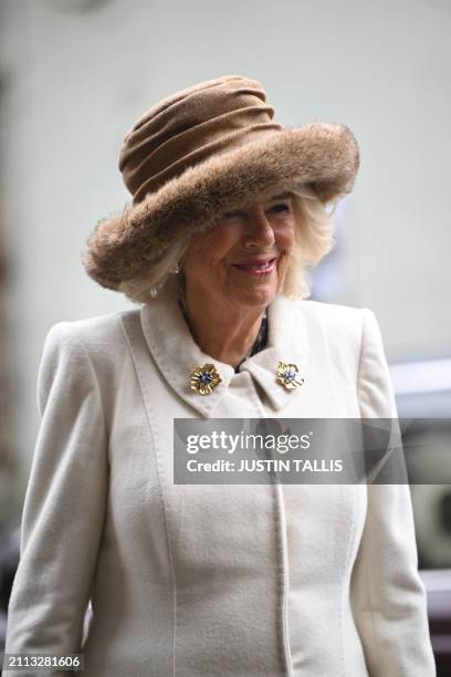 Britain's Queen Camilla smiles as she arrives for the Royal Maundy Service where she distributes the Maundy money to 75 men and 75 women, mirroring...