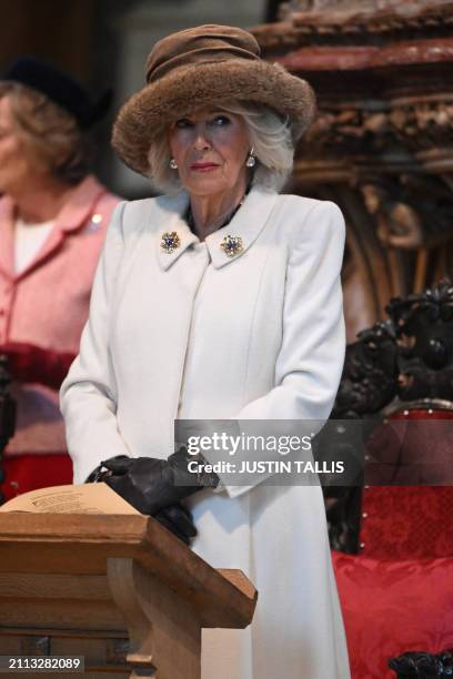 Britain's Queen Camilla attends the Royal Maundy Service where she distributes the Maundy money to 75 men and 75 women, mirroring the age of the...