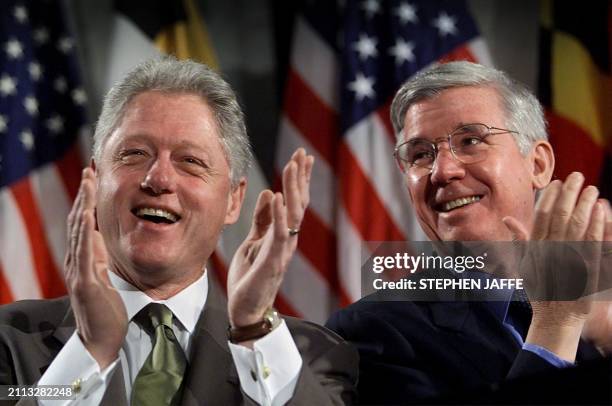 President Bill Clinton applauds with Marlyland Governor Parris Glendening prior to the signing the Responsible Gun Safety Act of 2000 at the State...