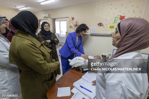 Foreign minister Hadja Lahbib pictured during a visit to the Palestinian refugee camp Al Am'ari, with UNRWA, on the West Bank, on day two of a...