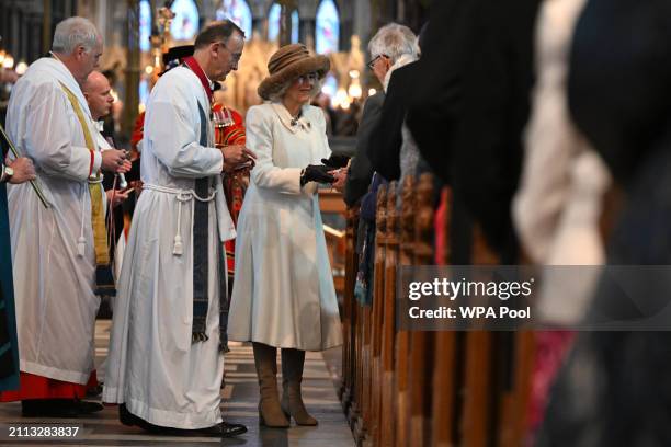 Queen Camilla hands out the Maundy Money during the Royal Maundy Service where she distributes the money to 75 men and 75 women, mirroring the age of...