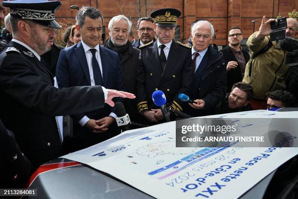 French Minister for Interior and Overseas, Gerald Darmanin looks at an explanatory placard of the newly launched "XXL cleanup" anti-drug operation in...