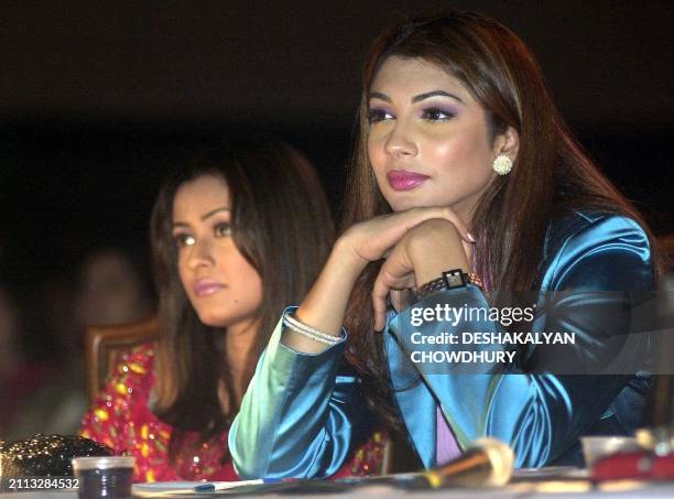 Former Miss World winner Yukta Mookhey and film actress Namrata Shirodkar , both members of the jury, watch the Mr. India 2001 competition in...