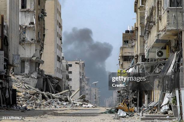 Smoke rises during an Israeli strike in the vicinity of the al-Shifa hospital in Gaza City on March 28 amid the ongoing conflict between Israel and...