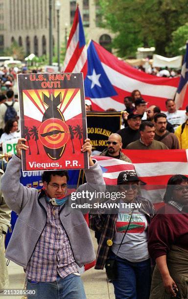 Opponents of the US Navy presence on the Puerto Rican island of Vieques protest 19 April, 2000 in Lafayette Park across from the White House in...