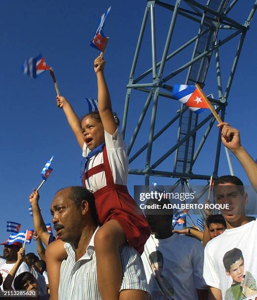 Cubans demonstrate 20 April in front of the office of the US Interests Section in Havana for the return of six-year-old Elian Gonzalez. The...